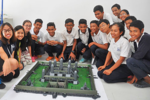 JPA Image Gallery - Students gather for a photo around their model of Angkor Wat - Jay Pritzker Academy, Siem Reap, Cambodia