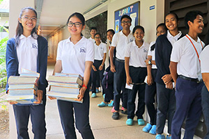 JPA Image Gallery - High school students queuing to receive their text books  - Jay Pritzker Academy, Siem Reap, Cambodia