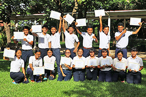 JPA Image Gallery - High school students pose for a photo with their certificates - Jay Pritzker Academy, Siem Reap, Cambodia