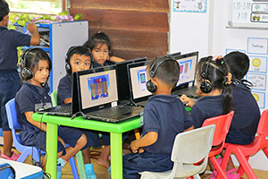 JPA Image Gallery - Kindergarten students working at laptops - Jay Pritzker Academy, Siem Reap, Cambodia