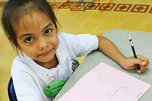 JPA Image Gallery - A primary student at her desk, ready to write - Jay Pritzker Academy, Siem Reap, Cambodia