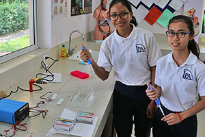 JPA Image Gallery - High school students work on a science experiment - Jay Pritzker Academy, Siem Reap, Cambodia