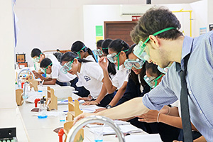 JPA Image Gallery - Chemistry class engaged in experiment in science lab - Jay Pritzker Academy, Siem Reap, Cambodia