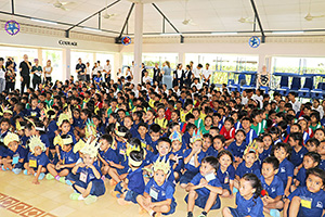 JPA Image Gallery - Kindergarten and primary students seated at an assembly - Jay Pritzker Academy, Siem Reap, Cambodia