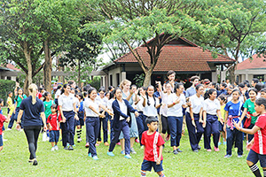 JPA Image Gallery - Large number of JPA students with teachers outside for an activity for Khmer New Year - Jay Pritzker Academy, Siem Reap, Cambodia