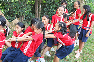 JPA Image Gallery - Primary students pulling rope in tug-of-war for Khmer New Year celebration - Jay Pritzker Academy, Siem Reap, Cambodia