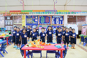 JPA Image Gallery - Kindergarten class standing for school pledge - Jay Pritzker Academy, Siem Reap, Cambodia