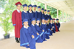 JPA Image Gallery - Class of 2019 pose for class photo in graduation gowns - Jay Pritzker Academy, Siem Reap, Cambodia