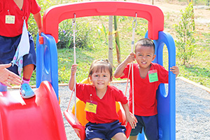 JPA Image Gallery - Preschool students enjoying the playground - Jay Pritzker Academy, Siem Reap, Cambodia