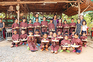 JPA Image Gallery - Primary students show off their clay art in group photo after pottery workshop - Jay Pritzker Academy, Siem Reap, Cambodia