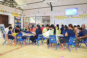 JPA Image Gallery - Parents and kindergarten students work together on an activity in classroom - Jay Pritzker Academy, Siem Reap, Cambodia
