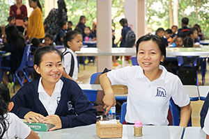 JPA Image Gallery - Two JPA students sit in the canteen - Jay Pritzker Academy, Siem Reap, Cambodia