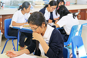 JPA Image Gallery - High school students seated at group tables focus on their studies  - Jay Pritzker Academy, Siem Reap, Cambodia