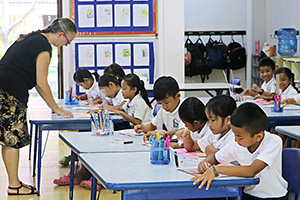 JPA Image Gallery - Grade 3 students add color to their worksheet - Jay Pritzker Academy, Siem Reap, Cambodia