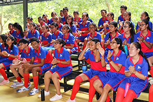JPA Image Gallery - Students in sport uniform cheer on their team mates from the bleachers - Jay Pritzker Academy, Siem Reap, Cambodia