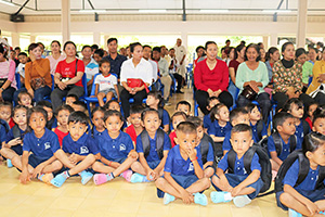 JPA Image Gallery - Preschool students and families seated at assembly - Jay Pritzker Academy, Siem Reap, Cambodia
