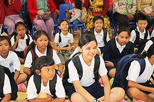 JPA Image Gallery - Primary students seated on floor at assembly - Jay Pritzker Academy, Siem Reap, Cambodia