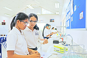 JPA Image Gallery - Chemistry students in lab working on an experiment - Jay Pritzker Academy, Siem Reap, Cambodia