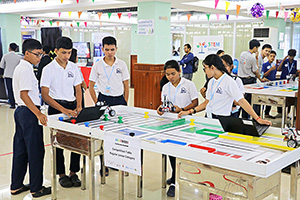 JPA Image Gallery - High school students with robot exhibit at World Robot Olympiad Cambodia - Jay Pritzker Academy, Siem Reap, Cambodia