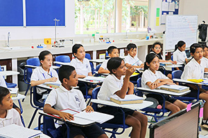 JPA Image Gallery - Students at desks listening to lesson in science classroom - Jay Pritzker Academy, Siem Reap, Cambodia