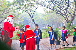 JPA Image Gallery - Santa greets students arriving at school - Jay Pritzker Academy, Siem Reap, Cambodia