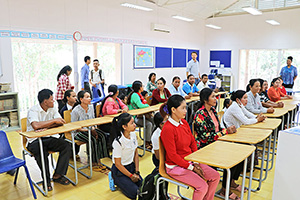 JPA Image Gallery - Parents and high school students listening to presentation - Jay Pritzker Academy, Siem Reap, Cambodia