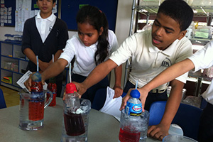 JPA Image Gallery - Students explore displacement in science class - Jay Pritzker Academy, Siem Reap, Cambodia