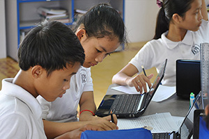 JPA Image Gallery - Students work on an assignment with their laptops - Jay Pritzker Academy, Siem Reap, Cambodia