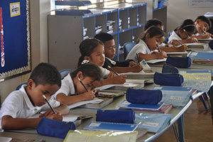 JPA Image Gallery - Primary students write at their desks - Jay Pritzker Academy, Siem Reap, Cambodia