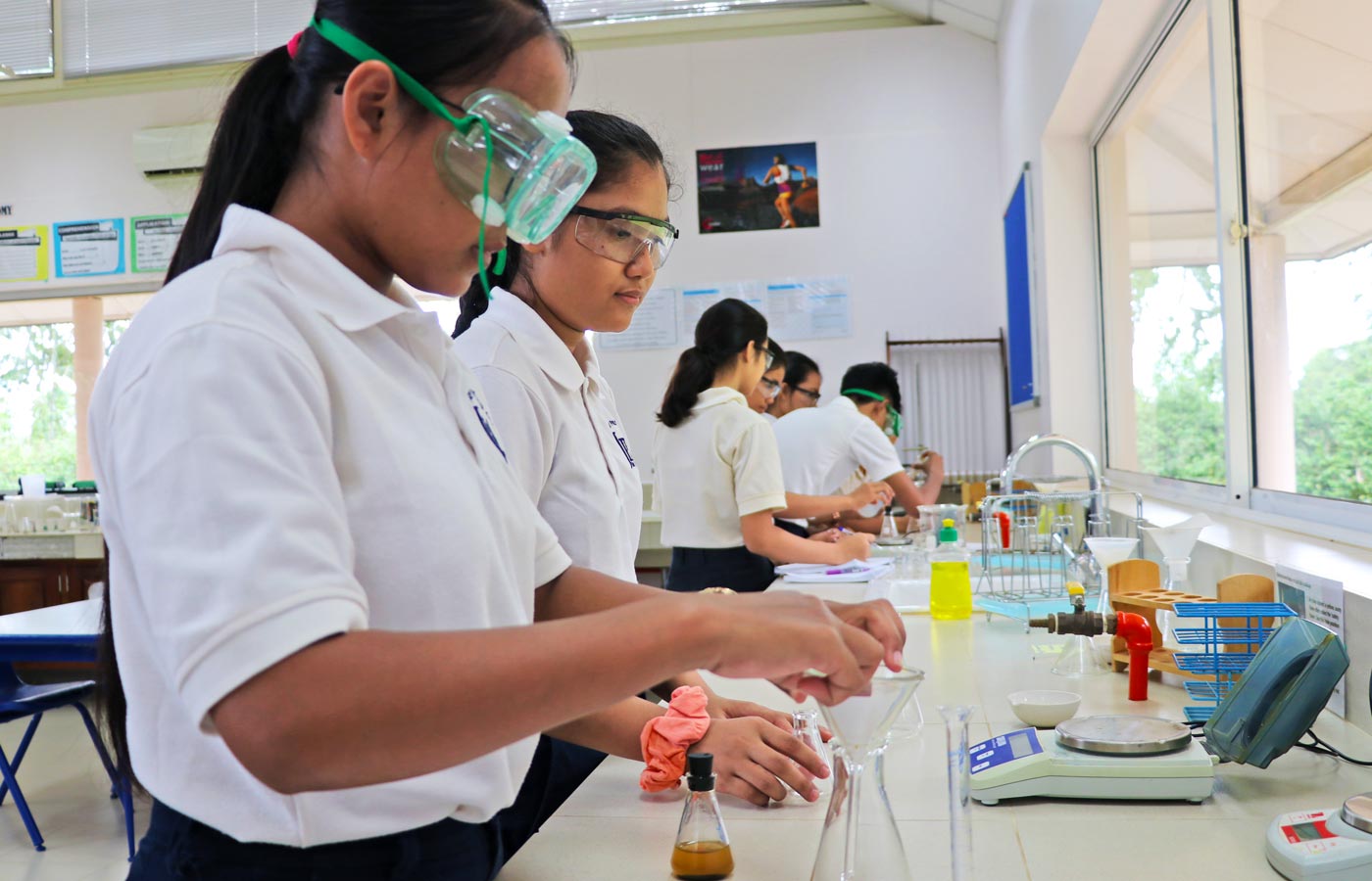Jay Pritzker Academy, Siem Reap, Cambodia. Grade 10 science students in the JPA science laboratory.